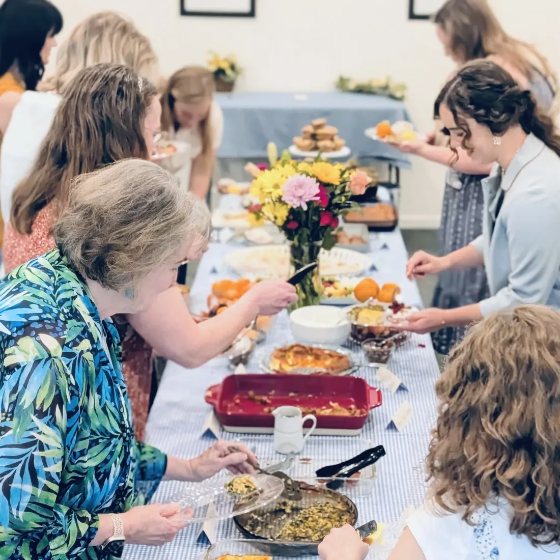 Church members serving themselves at a fellowship brunch
